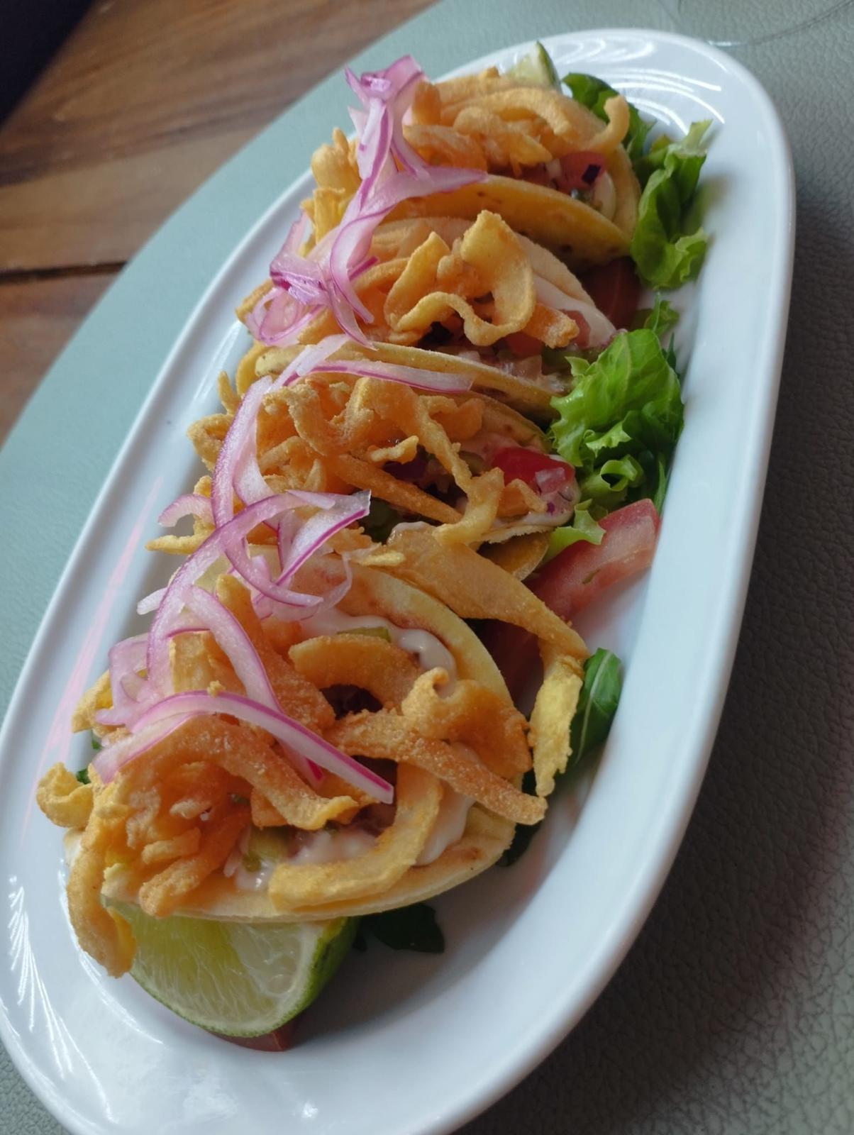 Traditional cuttlefish salad with onions and peppers