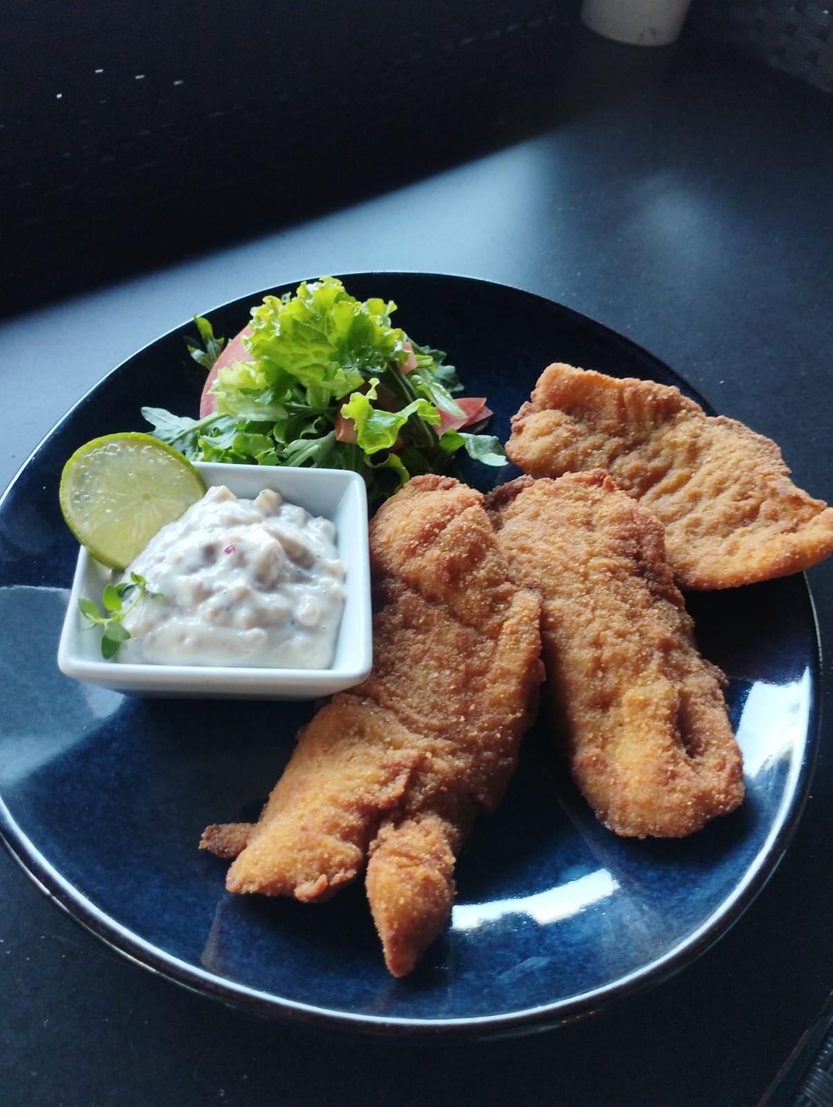 Breaded fish fillets with authentic Portuguese sides