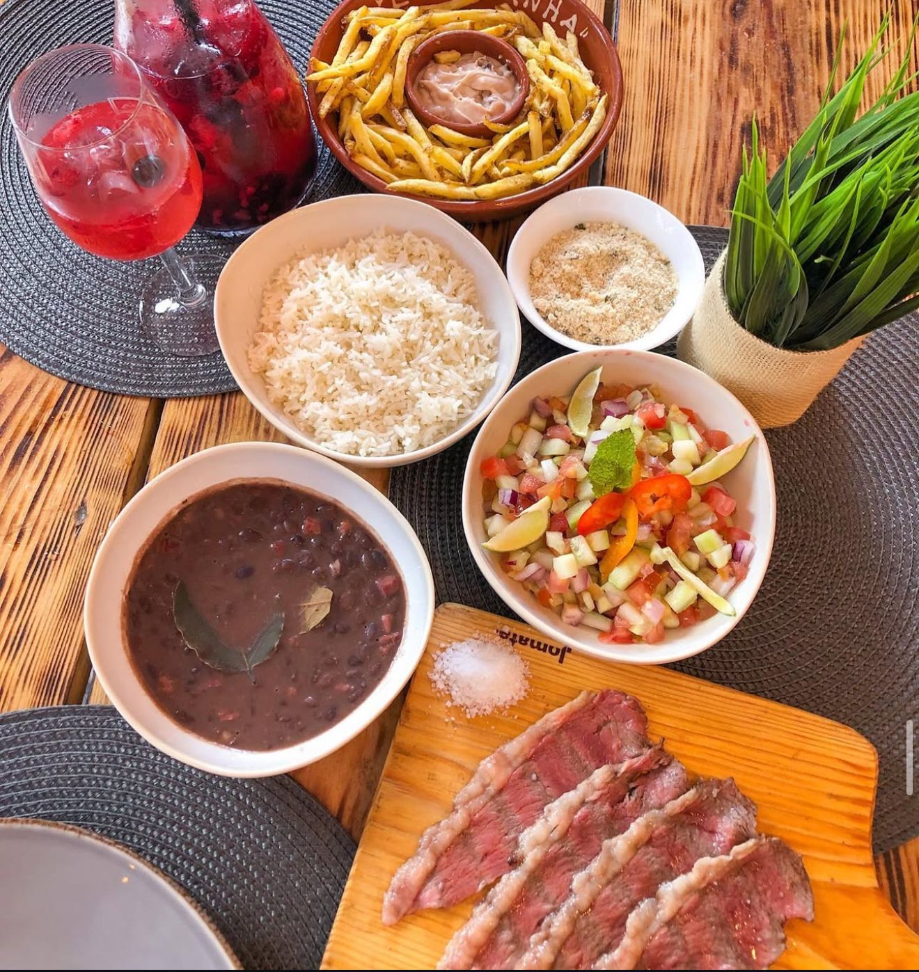 Picanha spread with sides and wine at Lapicanha