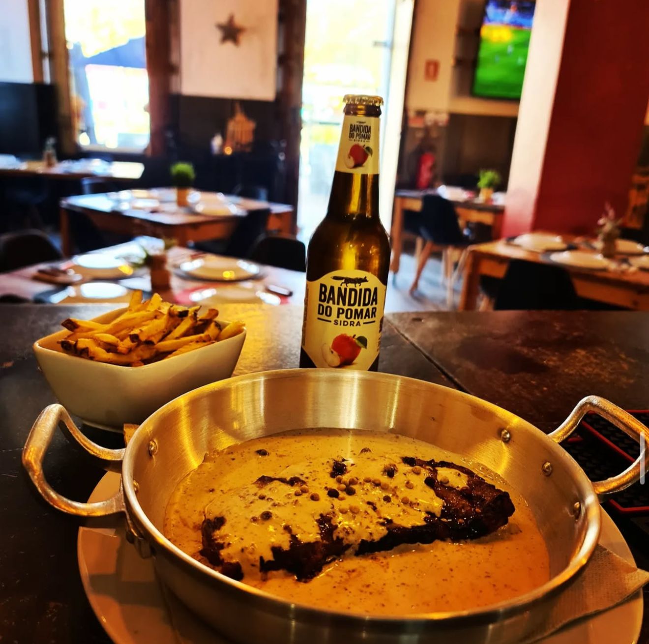 Traditional picanha in copper pan with Portuguese cider